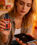 Woman holding Fast Scratch Fix For Screens And Glasses With Sponge Applicator, near smartphone with scratches.