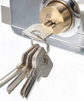 Heavy Duty Stainless Steel Front Door Safety Lock Set Featuring A Beefy Crescent Deadbolt with keys inserted into lock.