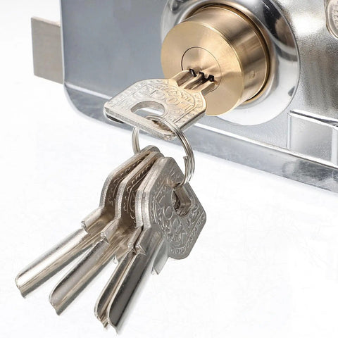 Close-up of keys in the Premium Interior Door Deadbolt Lock Set in Stainless Steel Finish for secure access.