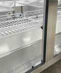 Interior view of Commercial Buffet Cold Table Refrigerator Delivers Prime Cooling And Slick Stainless Steel Exterior 72 Inch Wide Salad Display Counter Fridge Cooler.