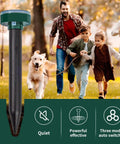 Family running with dog, showing 8 Pack Solar Powered Mole Repellent Stakes For Lawns Gopher Deterrent Ultrasonic Snake Repellent Deterrent