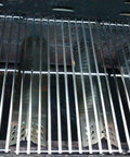 Open grill showing replacement heat plate shields and grates, part of Grill Replacement Parts Kit With Heat Plate Shield And Igniter For Nexgrill And Members Mark 720-0830 Series Four Burner Grills 720-0830H 720-0830D 720-0783E 720-0830A 720-0888 720-0830F.