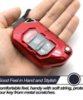 Hand holding Jeep Wrangler Red TPU Flip Key Fob Cover, showing protective shield and nylon cord attachment for JL JLU models.