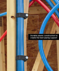 Half Clamp J Hook With Nail For PEX Tubing Support One Half Inch Black Durable Plastic Pipe Hanger on wood frame