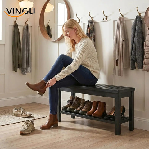 Woman sitting on Rugged Rustic Storage Bench With Solid Wood Seat And Slatted Shelf Indoor Outdoor Shoe Rack 450 Lb Capacity Black 40 Inch
