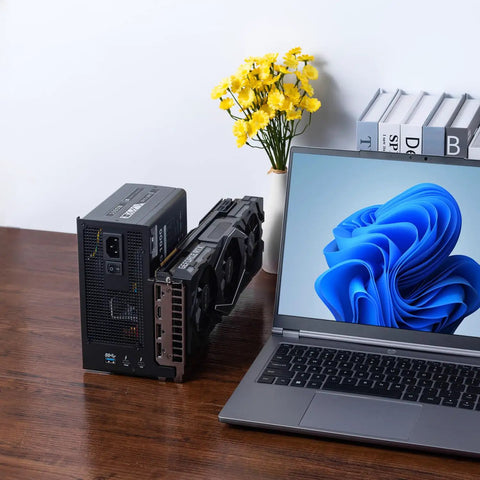 Absolute Beast Mini Egpu Enclosure With Forty Gbps Thunderbolt Three Four And Usb Four For Crisp Gaming And Smooth Ai Crunching Pcie External Dock next to a laptop on a table.