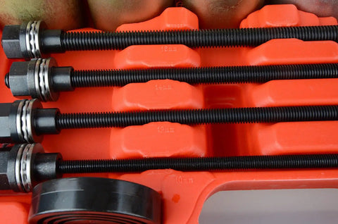 Close-up of threaded spindles from 26 Piece Universal Bushing Press And Pull Sleeve Kit for automotive repairs in orange case.