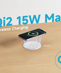 Slick Flush Mount Pop Up Socket Drops Straight Into Countertops Featuring Qi2 Magnetic Wireless Charger With 65W Fast Charging Double Usb Ports Zero Hassle Setup In Fresh White showing a smartphone wirelessly charging on a wooden desk.