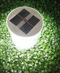 Inflatable Solar Lanterns 2 Pack For Camping Outdoor Use Waterproof Led Lights Rechargeable By Sun glowing on green leaves