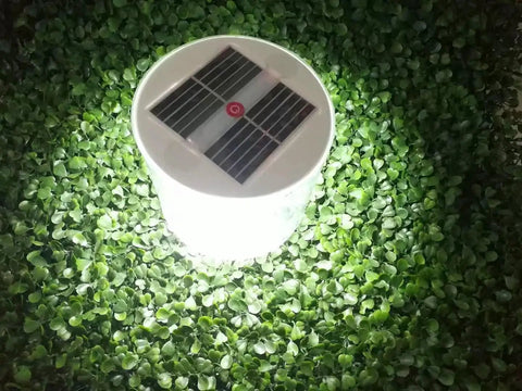 Inflatable Solar Lanterns 2 Pack For Camping Outdoor Use Waterproof Led Lights Rechargeable By Sun glowing on green leaves
