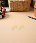 8 Piece Weight Driven Clock Chain Hook Set for Antique Grandfather Floor Clocks on a table with decor items.