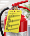 Must-Have Fire Extinguisher Monthly Inspection Tags 25 Pack With Adjustable Ties Yellow PVC Safety Labels attached to extinguisher