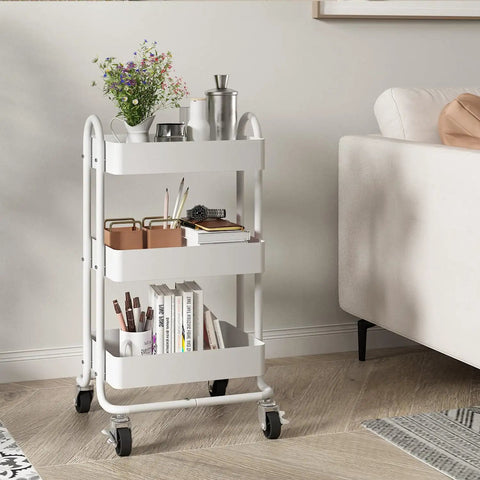 Three Tier Metal Rolling Cart With Wheels, Utility Cart On Casters For Office, Home, Kitchen Or Garden, White Finish, next to sofa