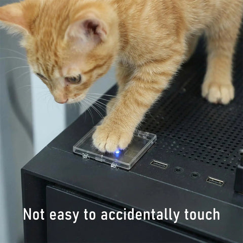 Kitten touching Two Pack Power Button Cover 55mm Dustproof Switch Protector on computer with blue light on top.