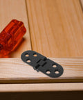 Beefy Heavy Duty Folding Table Hinges Aluminum Alloy Concealed Flip Hinges on wooden surface with red screwdriver