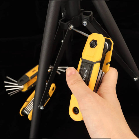 Hand using 17-Piece Folding Allen Wrench Set With Metric And SAE Hex Tools For Tight Spaces on bike frame