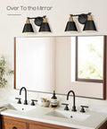 Two Pack Matte Black Vanity Light Fixtures With Hammered Metal Shade Over Mirror in Modern Bathroom