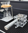Premium Clear Acrylic Espresso Tamper Station With Adjustable Height and Solid Portafilter Holder on countertop.