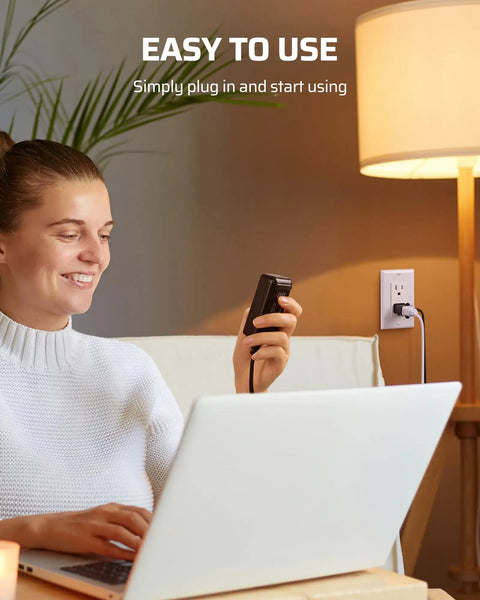 Woman using Plug In Lamp Dimmer Switch With Full Range Dimming And Smooth Slider in a cozy living room with a lamp