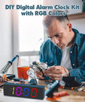 Man assembling DIY Clock Soldering Kit With 4 Digit Digital Alarm Clock, RGB Lighting Modes, in home setting