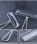 Heavy Duty Stainless Steel Paint Roller Set Two Piece Smooth Glide Action For Fast Canvas Coverage And Killer Oil Acrylic Finishes Game Changing Printmaking Essential viewed from above showing metal frame and transparent rollers.