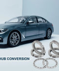 Locking Hub Spindle Nut Conversion Kit 32720 with nuts and washers, silver finish, next to a car model