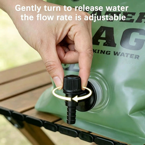 Hand adjusting spigot on Heavy Duty Portable Camping Water Bag With Spigot For Outdoor Drinking, leak-proof faucet shown.