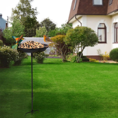 Sturdy Standing Bird Feeder Bowl On A 29.1 Inch Iron Stand, Detachable Outdoor Decor For Garden, Backyard, Patio Or Deck, Totally Built For Attracting Birds And Easy To Refill, Rust Resistant And Durable. Feeding birds in a garden setting.
