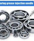 Assorted steel ball bearings of various sizes with a grease injection needle tool.