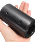 Heavy Duty Rigid Shaft Coupling Machined From Black Oxide Carbon Steel For Zero Slack Torque Transfer On 3D Printers And Motor Drivers Featuring Locked In Set Screws Built Legit And Ready To Go held in hand.