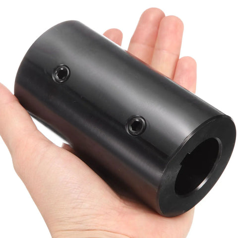 Heavy Duty Rigid Shaft Coupling Machined From Black Oxide Carbon Steel For Zero Slack Torque Transfer On 3D Printers And Motor Drivers Featuring Locked In Set Screws Built Legit And Ready To Go held in hand.