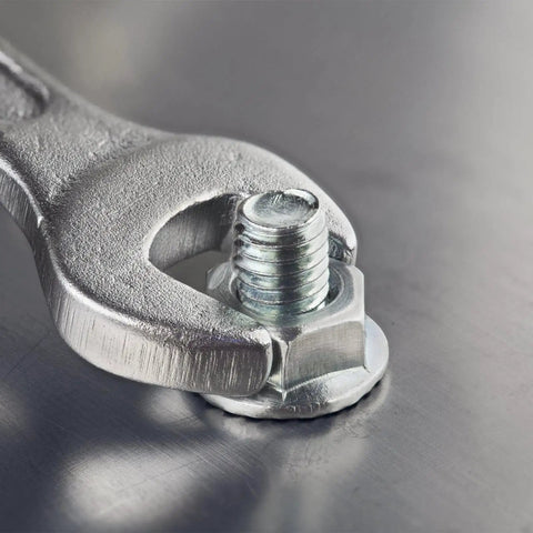 Close-up of wrench tightening nut on bolt from Heavy Duty Carriage Bolt And Nut Set With Washers, fully threaded, silver finish.