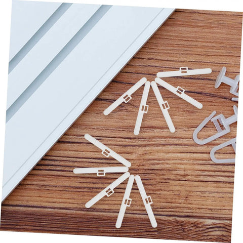 Vertical Blind Repair Kit 10 Pack Dual Hole Hangers For Quick Install Durable Plastic Window Blind Accessories visible on wood surface.