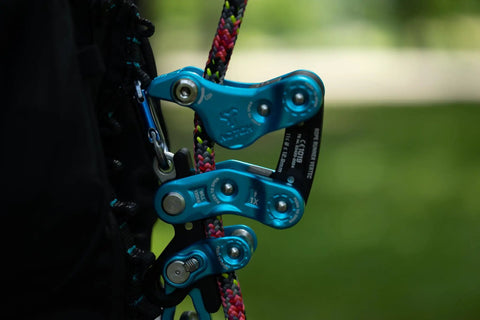Close-up of Rope Runner Vertec Ultimate Climbing And Work Positioning Device with rope, showcasing tool-free adjustability features.