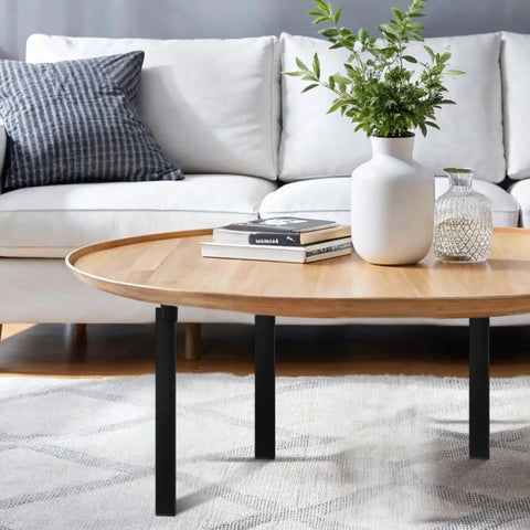 14 Inch Folding Table Legs 4 Pack Heavy Duty Metal Furniture Legs With Locking Hinges Mounting Screws, matte black supporting a wooden coffee table.