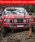 Red SUV in forest with Soft Shackle One Half Inch By Twenty Two Inch Recovery Rope attached for 57,000 lb strength