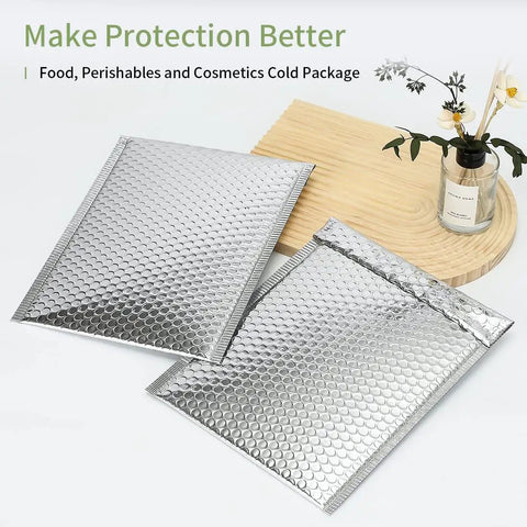 8X11 Thermal Bubble Mailers Pack Of 10 For Cold Shipping Insulated Foil Mailing Envelopes Waterproof Bubble Mailers For Food And Perishables Cosmetics Keeps Your Stuff Cold And Secure displayed with flowers.