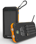 Solar Power Bank 20,000mAh Portable Charger On The Go With USB C Four Cables And Three Ports Fast Charging External Battery Pack, black and orange with dual flashlight, compass, and clip.