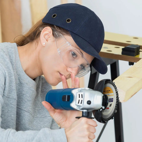 Woman using Heavy Duty Four Pack Of 4-1/2 Inch Wood Carving Discs With 7/8 Inch Arbor on 115Mm angle grinder.