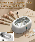 Deep Clean Master Ultrasonic Cleaner 45KHz 16oz stainless steel tank with makeup brushes and eyeglasses nearby
