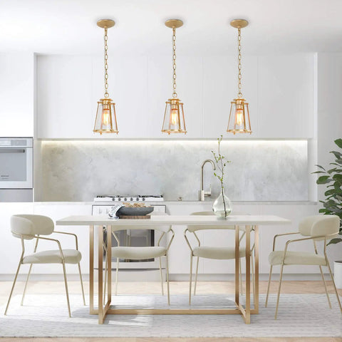 Gold pendant light fixture for kitchen island and dining room with brass hanging light and bubble seeded glass in modern kitchen