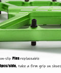 Close-up of green Grippy BMX MTB Pedals Fit 9 By 16 Inch Crank Lightweight Aluminum with non-slip pins and CNC machined platform.