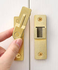 180 Degree Flip Barn Door Lock in Gold, heavy duty gate latch with flip safety bolt, installed on white sliding door, showcasing easy installation.