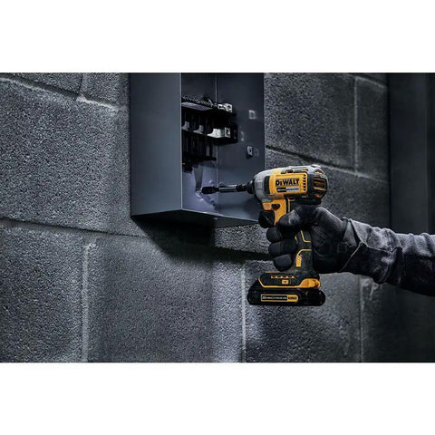 Person using 20V Max Cordless Impact Driver Kit With Brushless Motor One Quarter Inch Hex Chuck Two Batteries And Charger LED Light