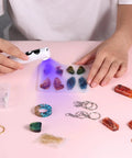 Person using UV light from All In One Resin Polishing Kit With Electric Rotary Drill And UV Light on resin crafts and jewelry
