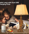 Mother and child reading in bed beside 29.5 Inch Tall Touch Control Traditional Table Lamp Set Of 2 With Dual USB Ports 3 Way Dimmable