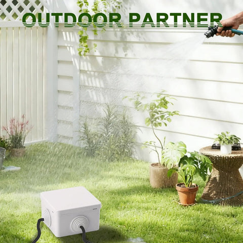 Rugged Outdoor ABS Junction Box Waterproof Case For Wires And DIY Projects, Shockproof Mini Storage, IP Rated Protection, Weatherproof Electrical Box, Compact 3.15x3.15x1.97 Inch, Built To Last. White ABS junction box on lawn with cables and hose spray