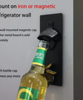 Heavy Duty Cast Iron Wall Mounted Bottle Opener For Draft Beer And Soda In Matte Black Finish Built Like A Tank Perfect Mounting Bracket For Your Garage Bar Or Home Stash Smooth Two Pack, mounted on refrigerator wall with bottle.