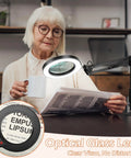 Elderly woman using 10X Real Glass Magnifying Glass With Light And Stand HD Optical Lens to read a newspaper