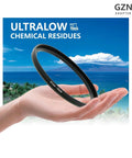 67mm To 77mm Step Up Filter Adapter Ring Built To Last Black Aviation Aluminum With Hand Holding Against Seascape Background
